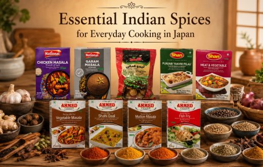 Essential Indian spices and various National, Shan, and Ahmed Foods recipe mix packets arranged on a wooden table