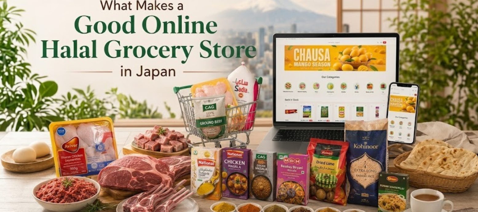 A laptop and smartphone showing an online store, with a shopping cart, assorted meat products, spices, and grains arranged on a table against a backdrop of a city and mountain view.